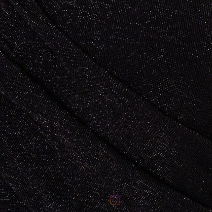 Vestido negro en tejido de punto de lurex brillante. 