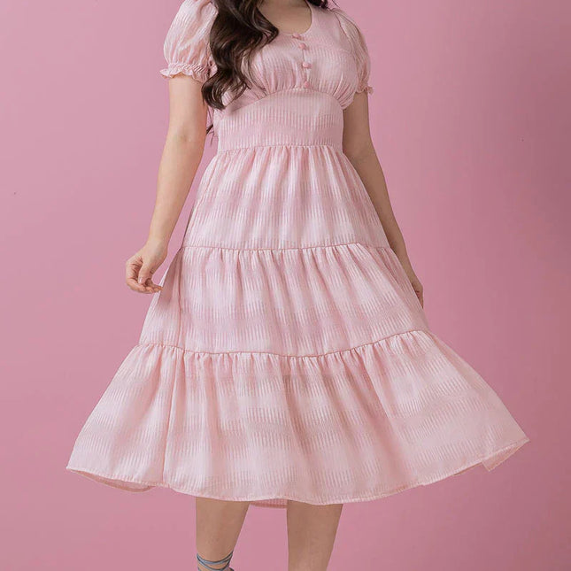 Vestido de gasa con botones falsos.